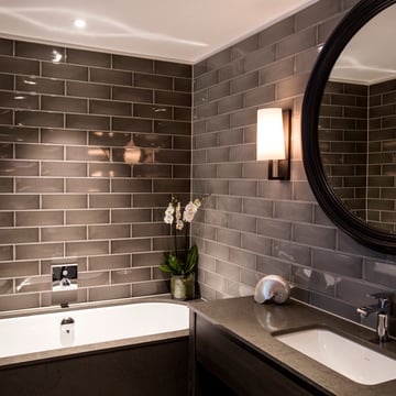 Dakota Hotel - guest bathroom featuring Riva 350 wall lights
