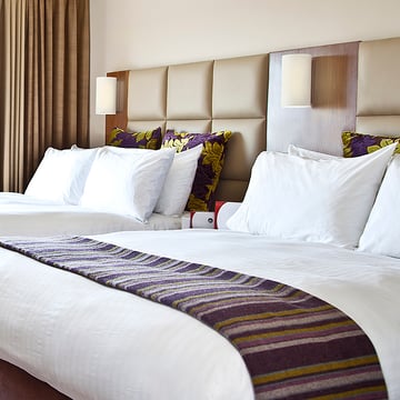 Crowne Plaza, UK - Guest bedroom featuring Astro's Cyl 260 wall light