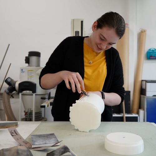 Employee working on product